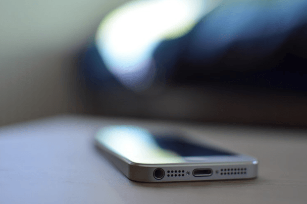 iPhone 5 in white bokeh focal point blurred background