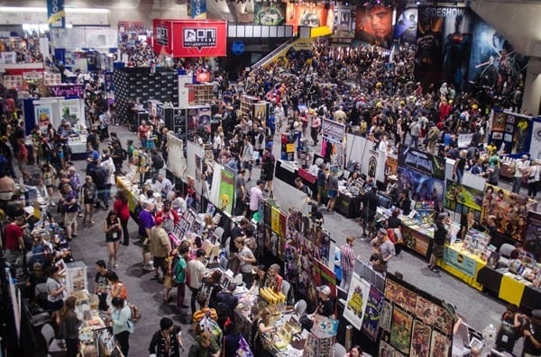 lots of people crowded at trade show booths