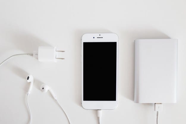 cellphone with power banking charger white background