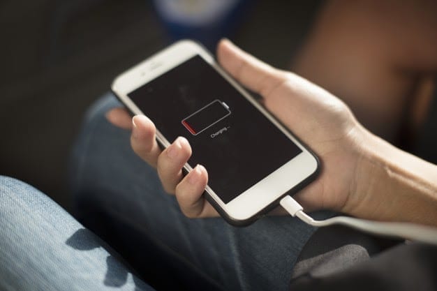 close up hands charging mobile phone