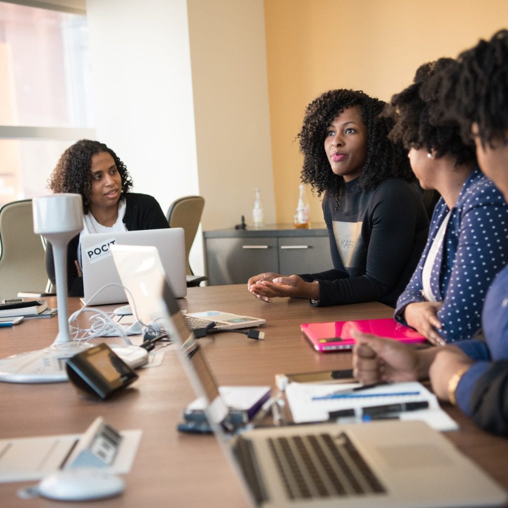 four woman at the conference room